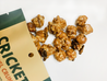 Caramel popcorn and peanuts with candied crickets.